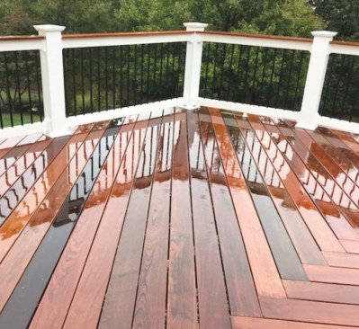 Ipe decking installed in a herringbone pattern adds an interesting twist to this wood deck’s classic look.