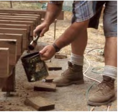 It’s a good idea to coat pressure-treated yellow pine end cuts with extra preservative. With hem-fir, which doesn’t accept pressure treatment well, it’s an absolute necessity to do so.