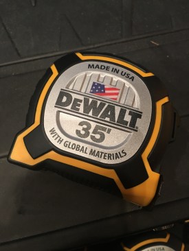 The DeWalt XP 35' tape measure has 9" of thermoplastic coating at the beginning of the blade, and a 13' standout. The rubber case is engineered to survive 60 foot drop onto packed soil. It weighs 1.65lbs, has a removable (tooless) belt clip, and costs $40. 