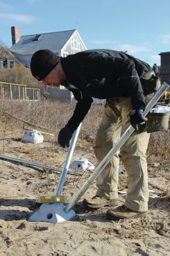 Fine adjustments can be made to the pier’s position after the 2-inch-diameter galvanized-steel pin pipes are inserted into the guide holes in the pier head. 