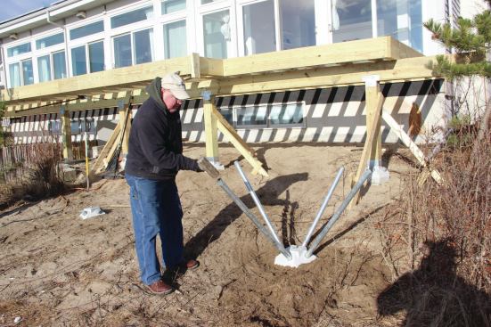 A sledgehammer is used to start the pins. In fact, it’s possible to fully drive the pins with the sledgehammer in this relatively soft sandy soil.