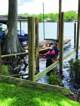 A second set of pilings are set parallel to the first.