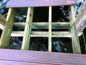 Hurricane clips tie the intermediate stringers to the 2x8 cross beams.