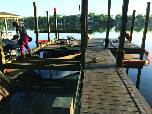 To provide support for a picture-frame border, the crew installs extra stringers between the pilings and adds blocking.