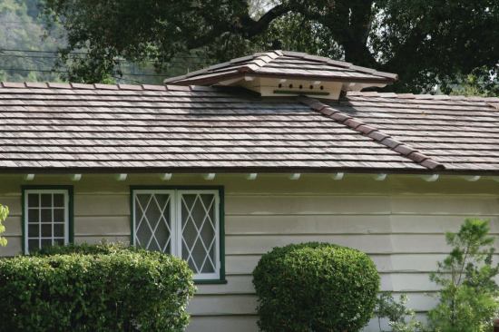 The cupola atop this ranch is an ornamental dovecote. Note the diagonal muntins in the windows, which are also common on Rustic- or Storybook-style homes.