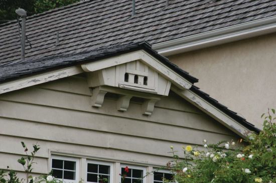 Another example of an ornamental dovecote is this structure tucked beneath a gable-end roof peak.