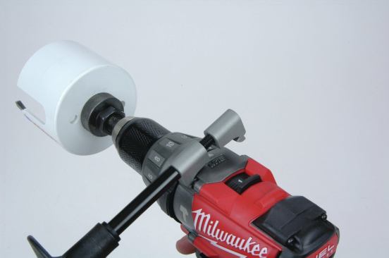 A nice feature of the Milwaukee (shown here), Makita, and Ridgid side handles is that they can be attached to the body of the tool quickly, without having to thread them over the chuck as with the other tools tested. This allows you to leave a wide bit on the tool while adding or removing the handle.