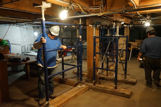 Two additional ladder frames, one each on opposite sides of the post, pick up the loads on the intersecting joists.