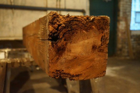 Once the structure is supported, the old post was removed and set on sawhorses, so the rot can be cut away.