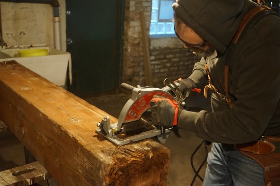 The author uses a beam saw to cut off the rotten end, taking a pass at full depth on all sides.