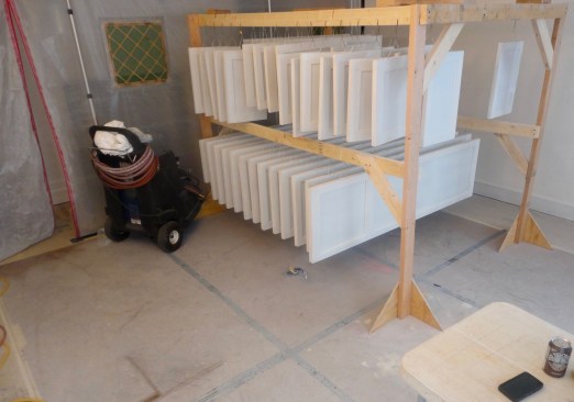 During the remodel, the master bedroom was used as a spray booth for cabinet door. The finished floor is beneath heavy paper covered with hardboard.