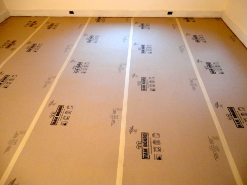 The author often wraps finished floors with a dense paper product such as Ram Board,