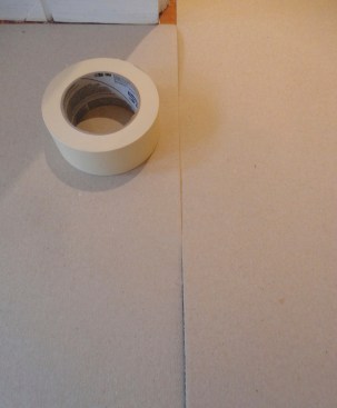 One trick is to flip the paper over so the curl faces down. Courses then butt easily and can be taped.