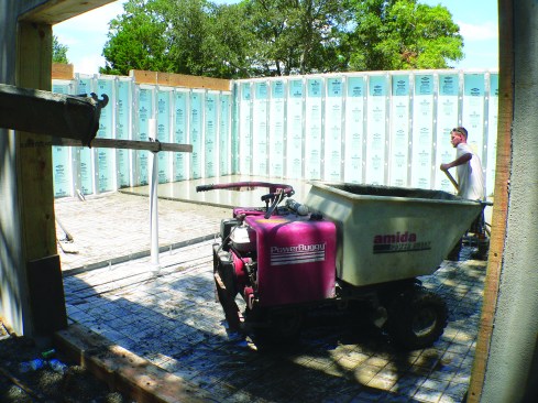 The ground inside the wall system is prepped for the poured slab.