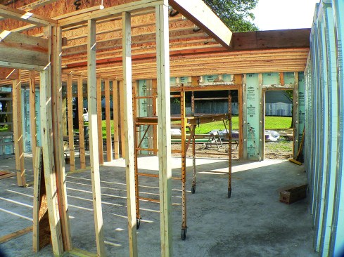 A 2x4 on the flat is cast into the pocket formed by the "rim ledge" as a nailer and bearing shelf. 