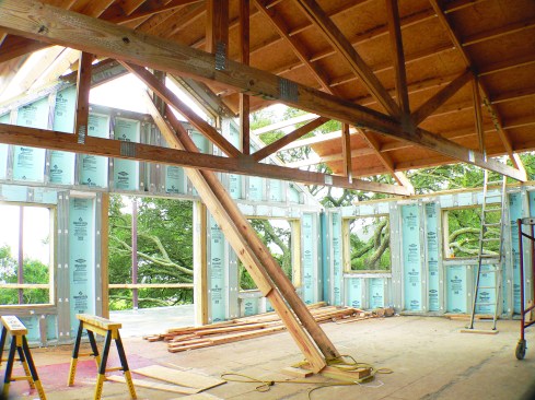 On this project, the Superior Walls crew set the gable end panels on the same day as the upper-story wall panels.