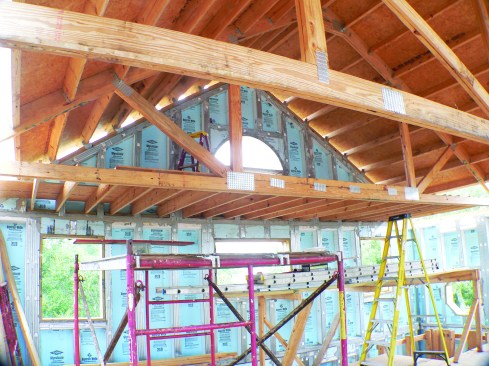 The framers framed the roof using a system of girder trusses and purlins.