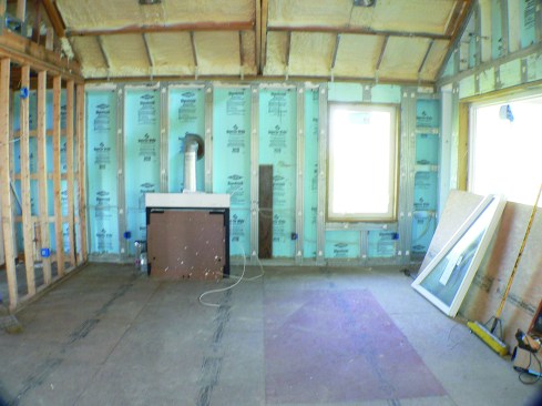 The underside of the 5/8-inch plywood roof sheathing is insulated with 3 inches of sprayed closed-cell polyurethane.