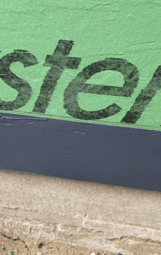 The tape makes it look nice, but it also allows the installer to apply a thick bed of sealant that is free of pinholes—a detail that trying to feather the edge to a chalk line won’t effectively achieve.