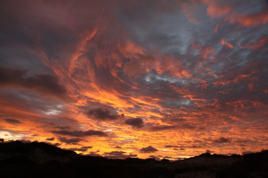 The openness of the dunes brings some impressive sunrises and sunsets during dramatic weathe.