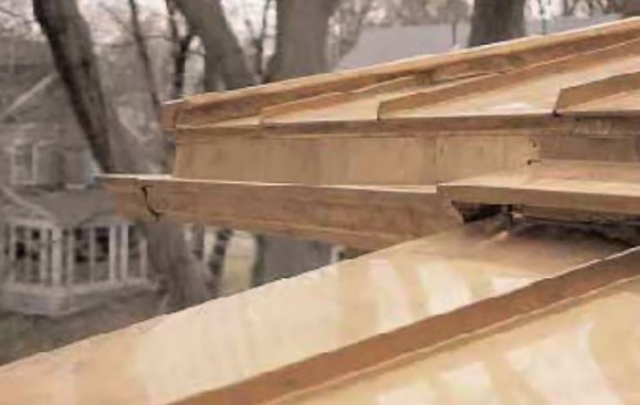 Figure 5. Properly flashed gutters keep water out from between the gutter and fascia boards. Gutters should also be cleaned frequently to prevent clogging and overflow.