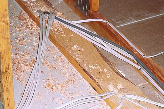 Top plates of partition walls in attics are huge sources of air leaks, made worse by all the electrical penetrations.