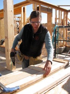 A workshop participant builds a Larsen truss using a jig. "That person had never handled a nailgun before that day," says Robert LaPorte. Classes typically include a mix of professional tradespeople and owner-builders.