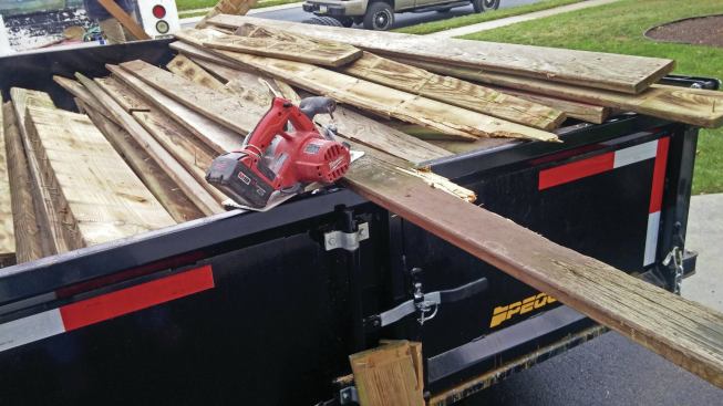 A cordless circular saw is handy for cutting old decking and framing to length so that it stacks efficiently in the back of a pickup truck or in a cargo or dump trailer. 