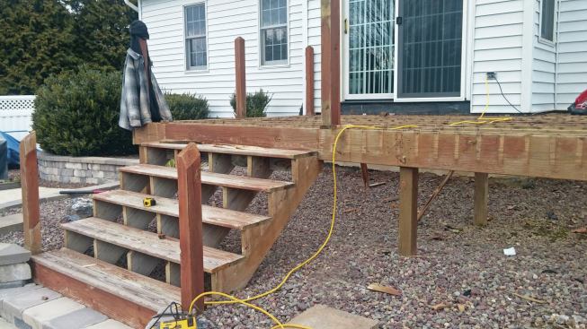 A typical demolition job starts with rail removal, followed by the decking. For easier access, the steps are left in place until it’s time to remove the framing. 

