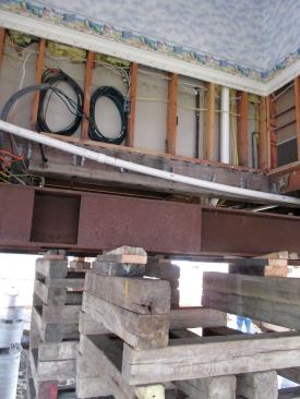 The house took on just over a foot of water, so this meant that the insurer would replace the first 4 feet of wall finishes and insulation, and all the wiring. When the water rises over outlet height, water wicks up the paper insulation and can damage wiring all the way to the second floor.