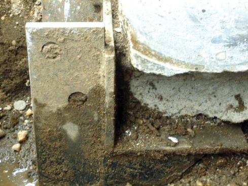 The bracket supports the footing edge.