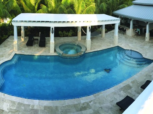 This home, like many high-end homes, features a custom swimming pool.