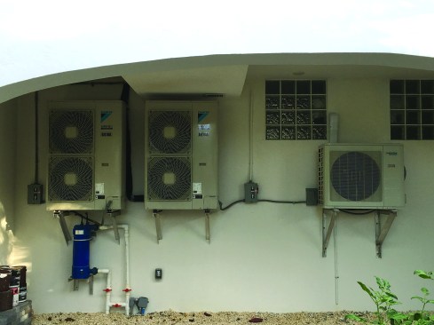 It gets its heat from waste heat recovered using a condenser spliced into the air
conditioning system’s refrigerant line.