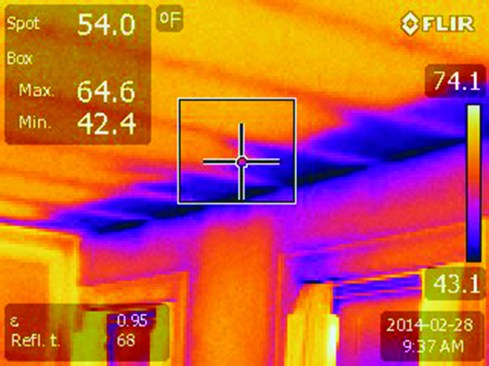 The infrared image reveals the cause: heat loss through the ceiling and roof of the kitchen bump-out.