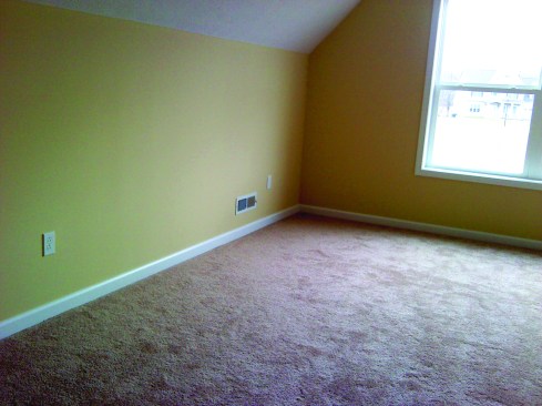 In the bonus room over a garage, a cold wall and floor brought comfort complaints.