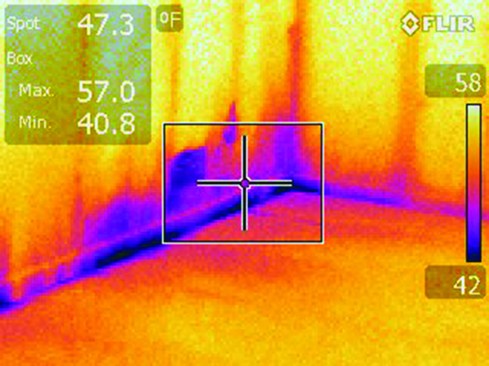 The infrared camera revealed the cold air infiltration’s leak point.
