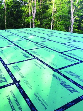 The Zip System sheathing on the attic floor creates a tight air seal.