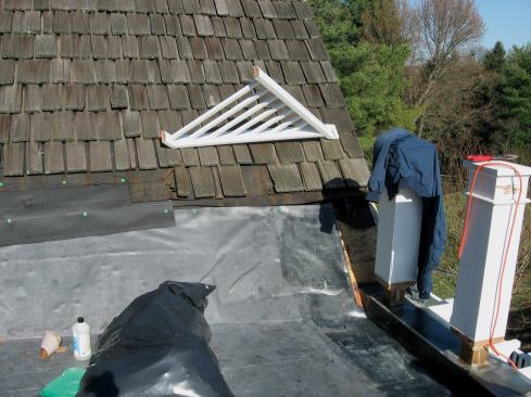 To protect against water backing up—whether from leaf clogging, ice dams, or even just wind exposure—you need to bring the membrane for the lower roof up about 18 to 24 inches. This is the vertical rise, which means you are running something like 25 to 36 inches up the roof, depending on the slope. Many details call for an 8- to 12-inch vertical, but this just isn't sufficient.
