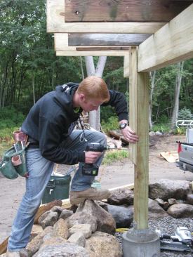 Once the pier has been assembled, framing can begin immediately. The connecting rod doubles as the anchor for the post base.