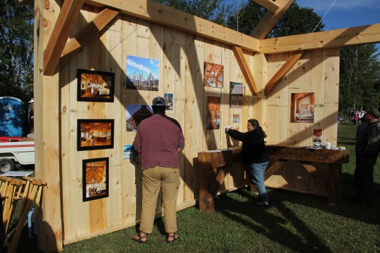 Chris Krouse and mom Toni Krouse decorate the booth as fair-goers start to arrive on the first morning of the fair.