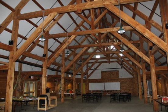 A view of the timber frame in the open main hall at the Common Ground fairgrounds, which measures 60 by 80 feet. R. A. Krouse built this frame in 1999.