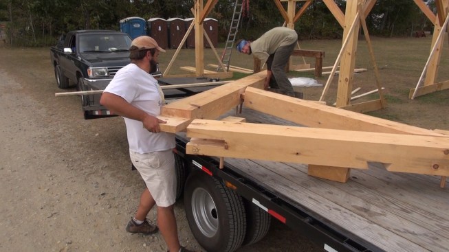 After driving out the pegs, Chris and Toby pull the rafters and collar tie apart.