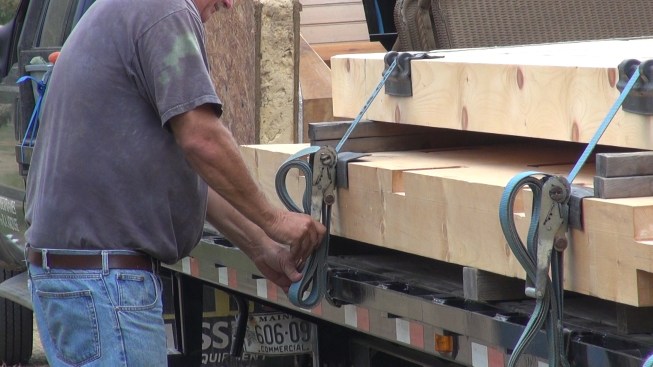 Readying for the drive home, Richard cinches down the load straps and secures the excess.
