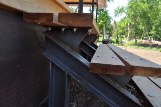 Architect Eric Rauser, AIA designed some awesome steel stringers with bolted cedar steps.