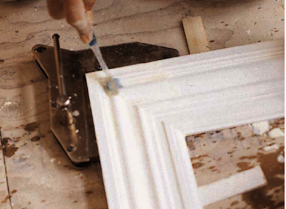 Thin shims bring slightly twisted joints into plane before clamping. Excess glue is cleaned up with a toothbrush and hot water, then blown dry with an air hose.