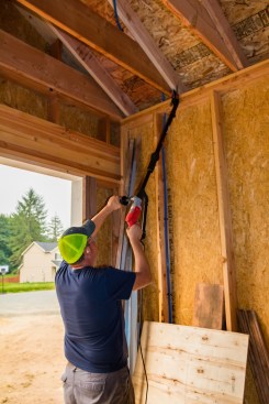 Ladder-free installation. The FrameFast proves to be a much faster way to make code-approved truss- and rafter-to-top-plate connections.