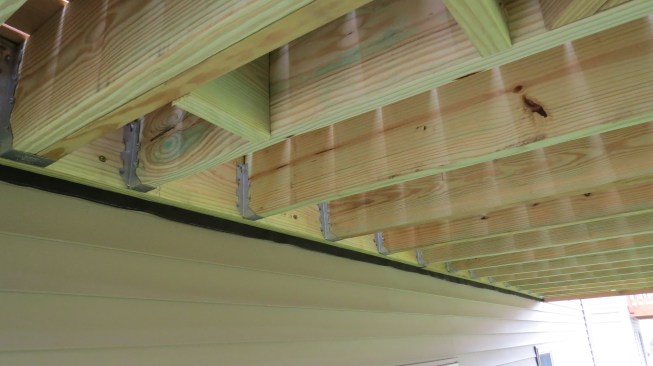 Ledger with proper joist hangers installed | Courtesy of Tim Brown, PHI Decks