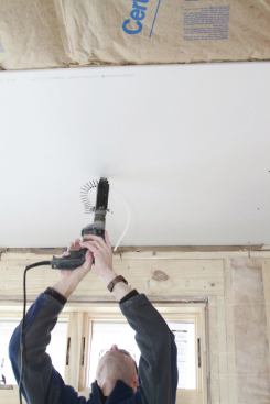 Fasten across the sheet. I do this along studs and joists to flatten the panel against the framing, but it’s critical on ceilings.