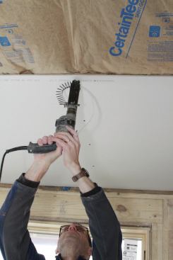 Fasten across the sheet, installing screws in sequence to take out any sag. Don’t put one screw in one corner and then jump to the end and fasten it in the opposite corner.