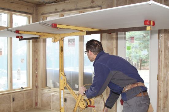 Using a drywall lift is an efficient way to drywall ceilings.